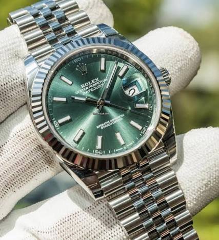 Rolex Datejust green dial watch with fluted bezel and Jubilee bracelet